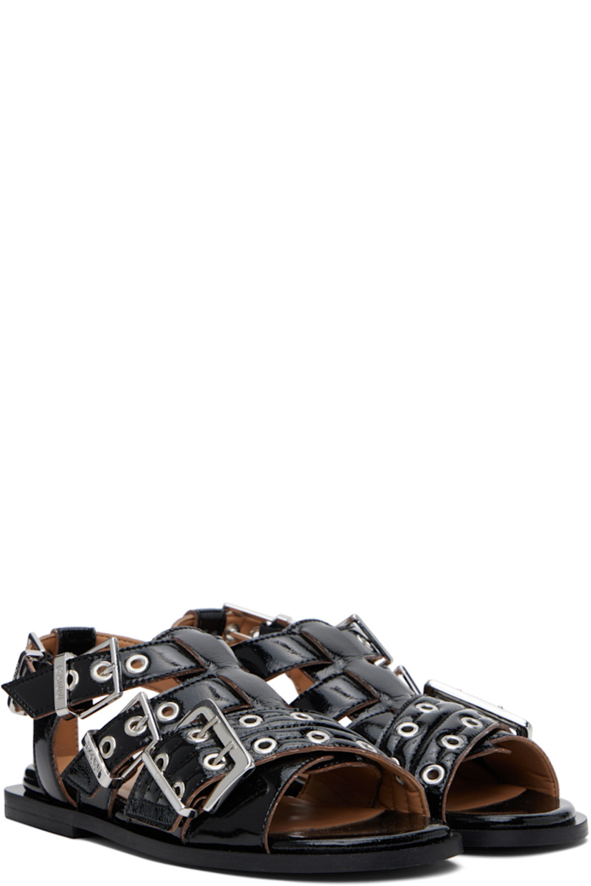 Patent faux-leather flat sandals in black.

· Open toe 
· Pin-buckle crisscrossing straps at vamp
· Partially elasticized pin-buckle slingback strap
· Logo embossed at padded footbed
· Buffed faux-leather lining
· Stacked rubber block heel
· Faux-leather sole
· Logo-engraved silver-tone hardware

Supplier color: Black