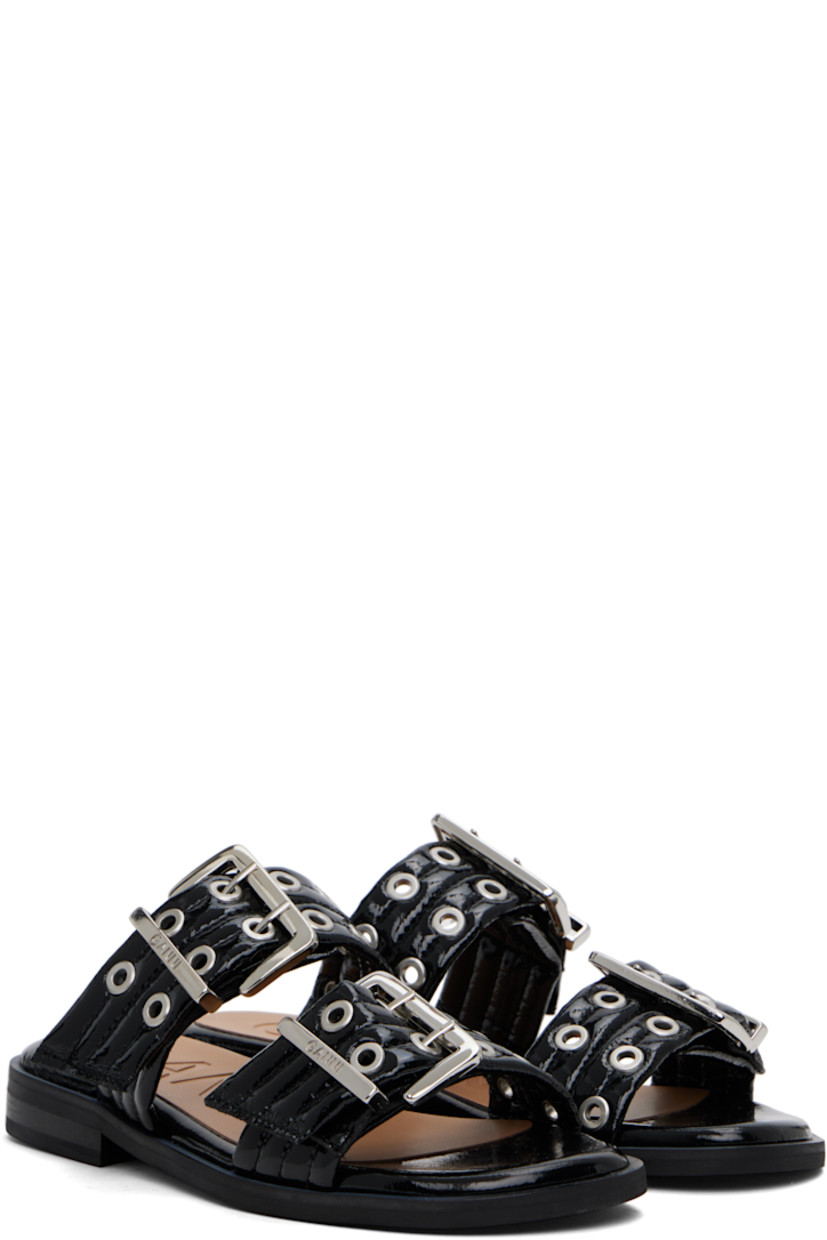 Quilted patent faux-leather slip-on flat sandals in black.

· Open toe
· Pin-buckle straps at vamp
· Logo embossed at padded footbed
· Stacked rubber block heel
· Faux-leather sole
· Logo-engraved silver-tone hardware

Supplier color: Black