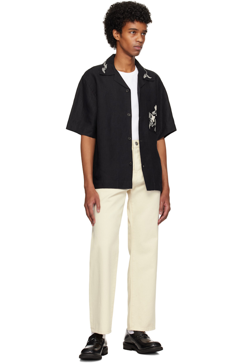 Loose-fit non-stretch denim jeans. 

· Belt loops
· Four-pocket styling
· Button fly
· Logo-engraved antiqued silver-tone hardware

Supplier color: Natural white