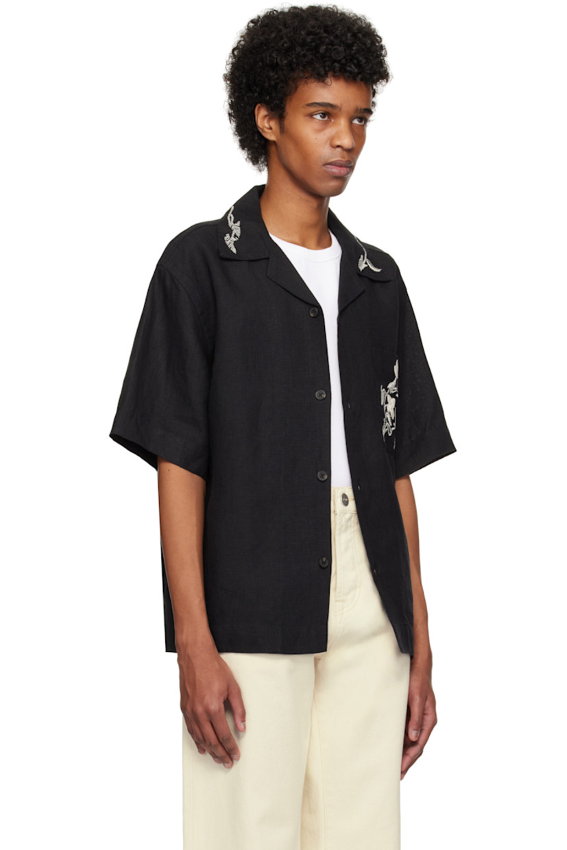 Linen hopsack shirt. Hand-embroidered detailing at collar and pocket.

· Open spread collar
· Button closure
· Patch pocket
· Dropped shoulders

Supplier color: Black