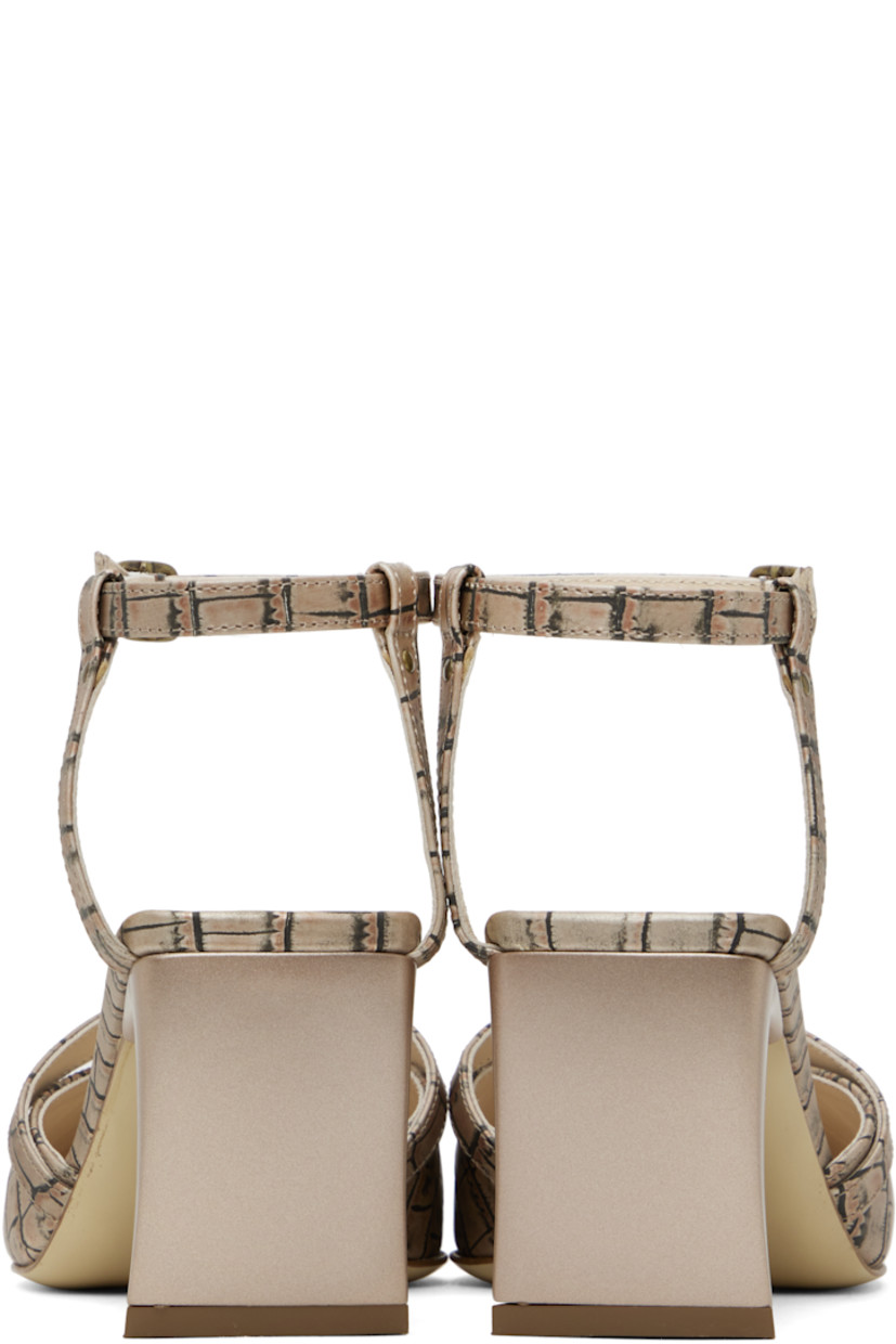 Croc-embossed leather mules in beige and black.

· Pointed square toe 
· Pin-buckle strap, rivet, and cutouts at vamp
· Pin-buckle ankle strap
· Logo-embossed padded leather footbed
· Covered block heel with rubber injection
· Leather sole
· Heel: H2.75"

Supplier color: Beige croc