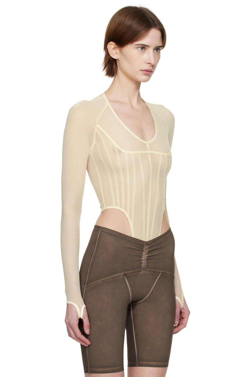 Stretch nylon mesh bodysuit.

· Plunging scoop neck
· Adjustable press-stud closure at bottom
· Thumbhole at cuffs

Supplier color: Ecru