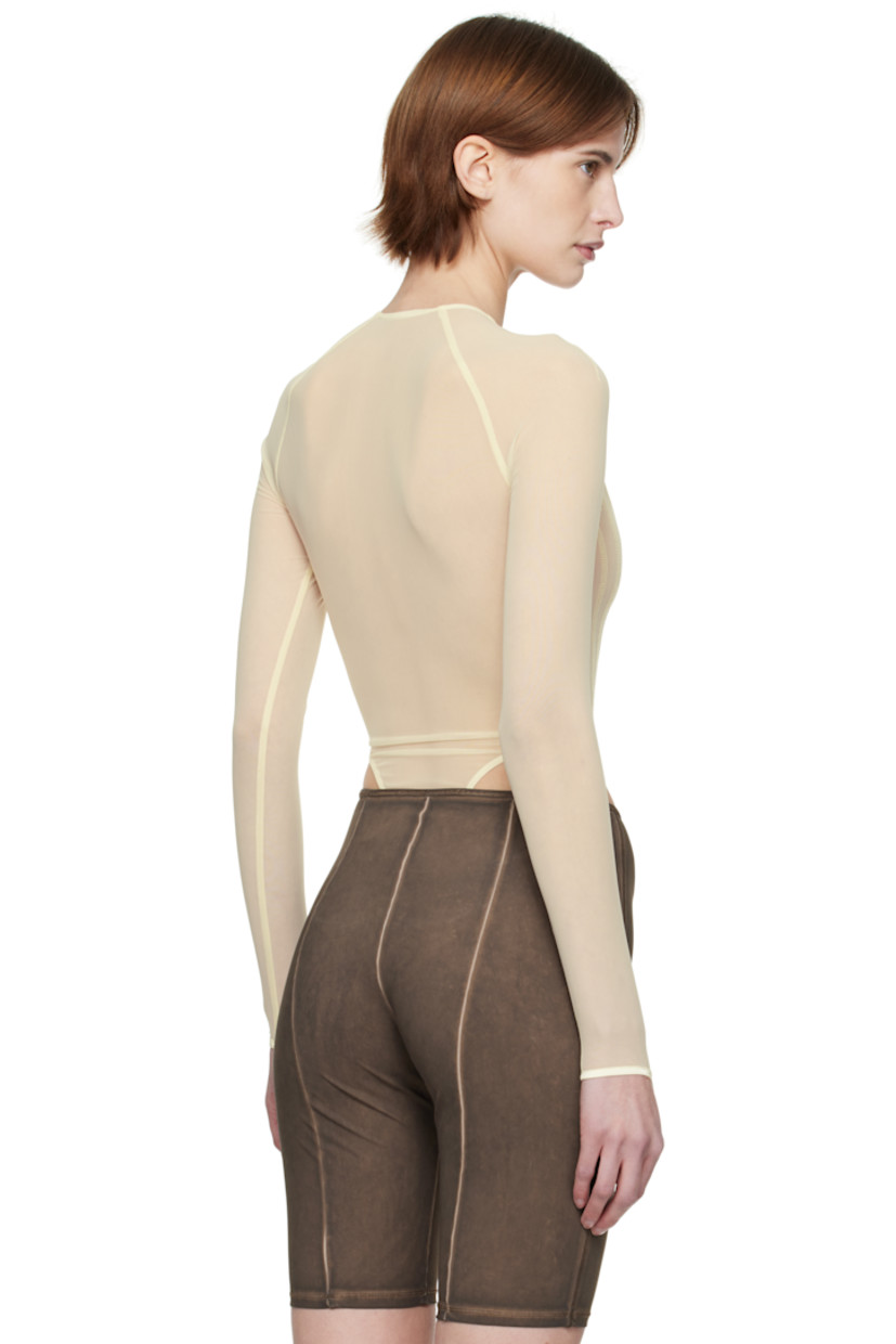 Stretch nylon mesh bodysuit.

· Plunging scoop neck
· Adjustable press-stud closure at bottom
· Thumbhole at cuffs

Supplier color: Ecru