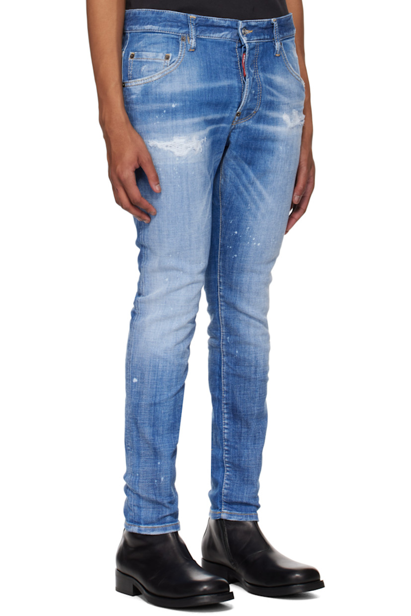 Slim-fit stretch denim jeans. Fading, whiskering, distressing, and paint splatter throughout. 

· Belt loops
· Five-pocket styling
· Logo flag at button fly
· Logo patch at back waistband
· Logo-engraved silver-tone hardware
· Contrast stitching in tan 

Supplier color: Navy blue