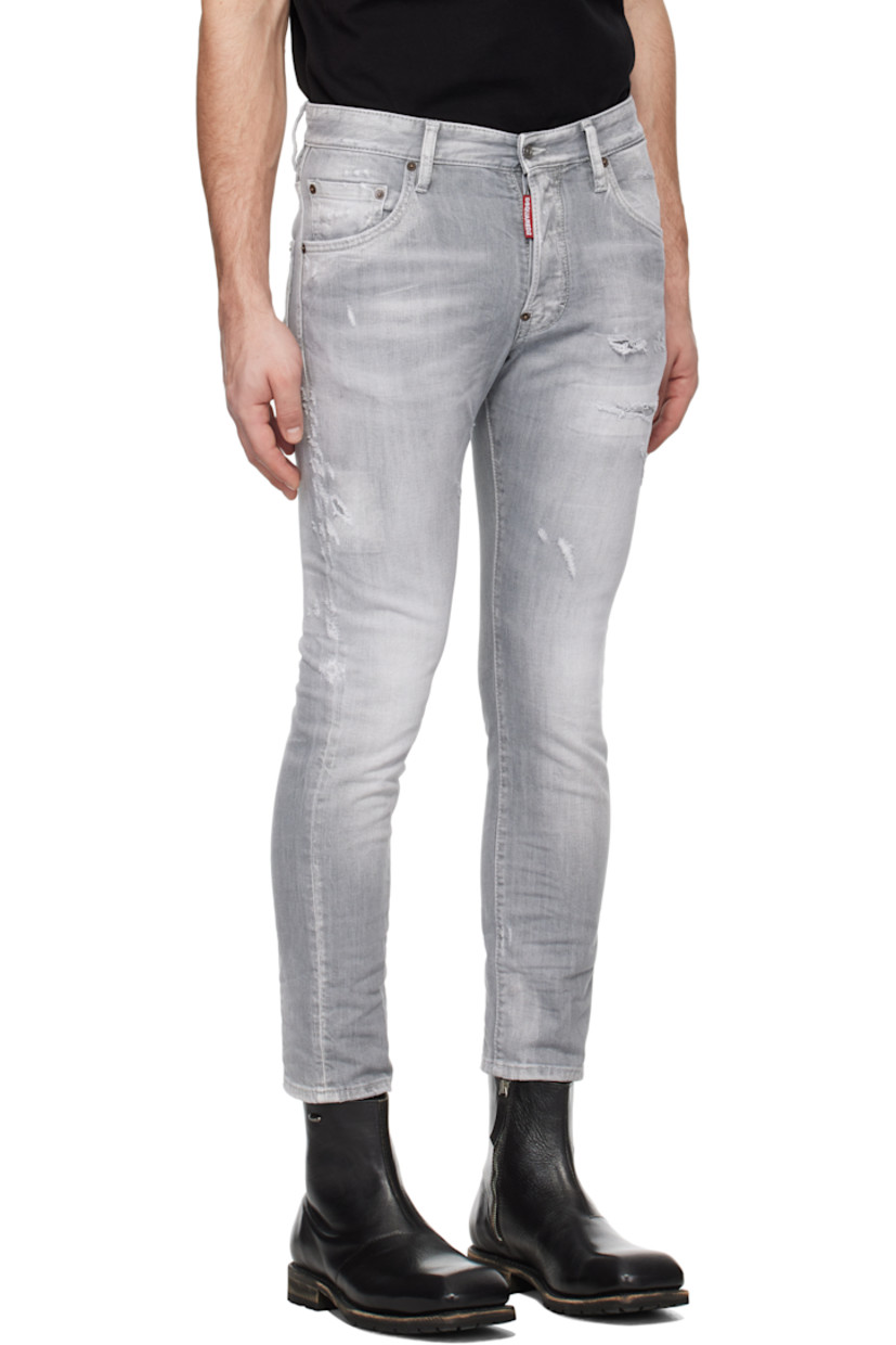Slim-fit stretch denim jeans. Distressing, fading, and whiskering throughout.

· Belt loops
· Five-pocket styling
· Logo flag at button-fly
· Logo patch at back waistband
· Logo-engraved silver- and copper-tone hardware

Supplier color: Grey