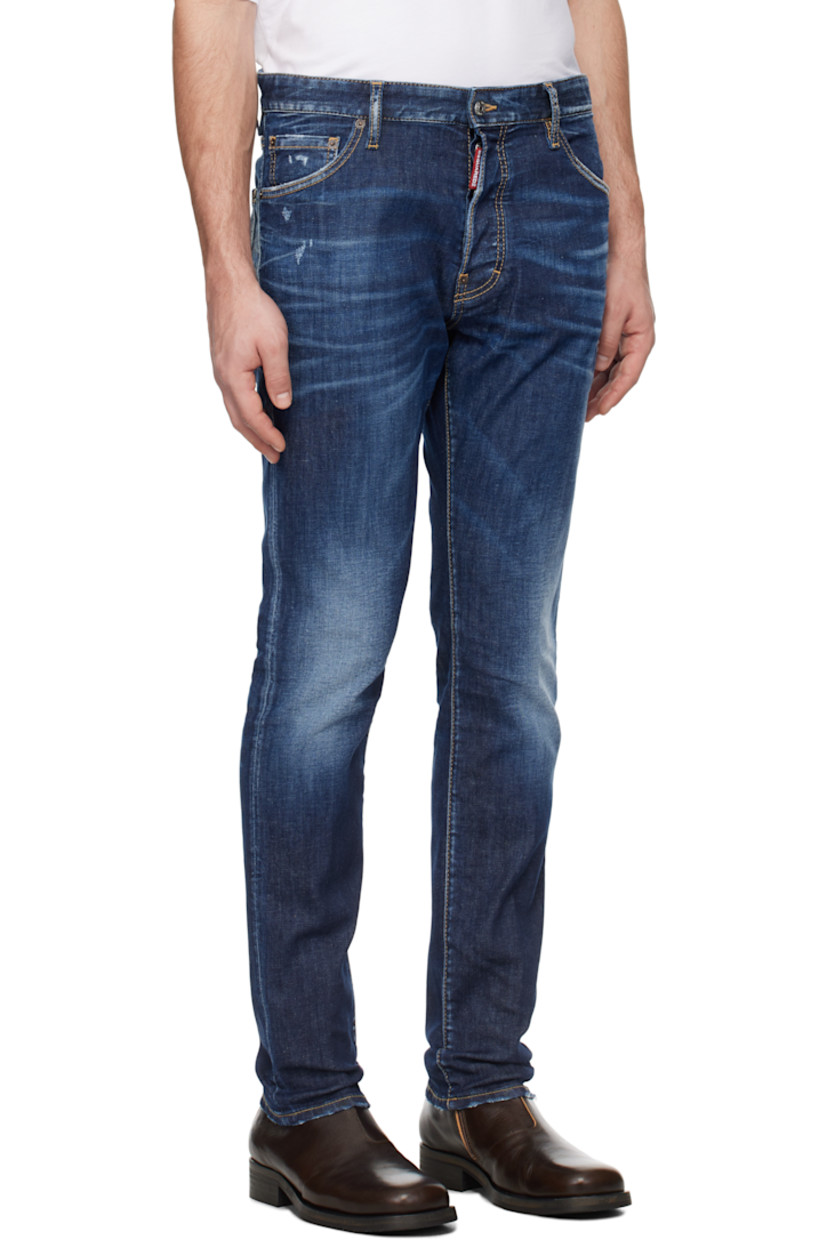Slim-fit stretch denim jeans. Fading, whiskering, and distressing throughout.

· Belt loops
· Five-pocket styling
· Logo flag at button-fly
· Logo graphic patch at back waistband
· Logo-engraved silver- and copper-tone hardware
· Contrast stitching in tan

Supplier color: Navy blue