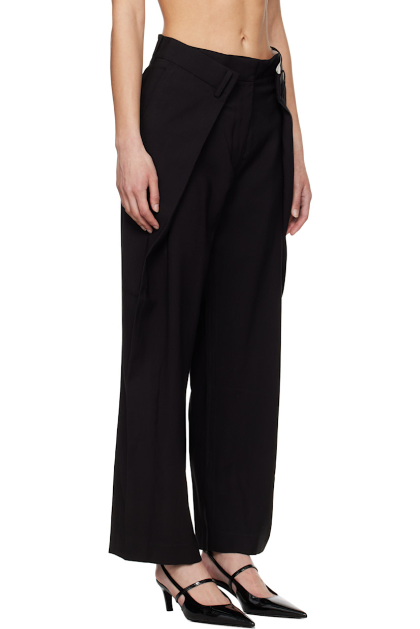 Viscose- and tencel-blend twill trousers. 

· Belt loops
· Folds at front waistband 
· Four-pocket styling
· Zip fly
· Pleats at front 

Supplier color: Black