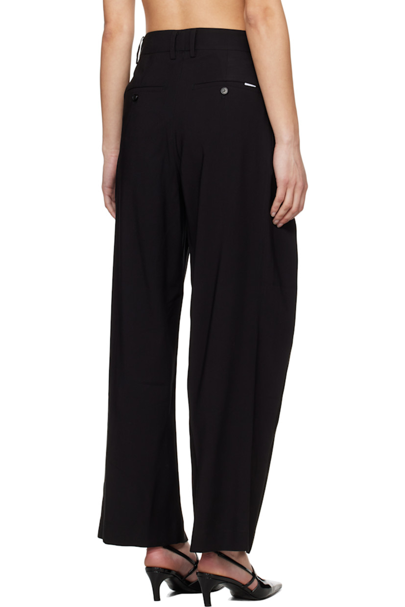 Viscose- and tencel-blend twill trousers. 

· Belt loops
· Folds at front waistband 
· Four-pocket styling
· Zip fly
· Pleats at front 

Supplier color: Black
