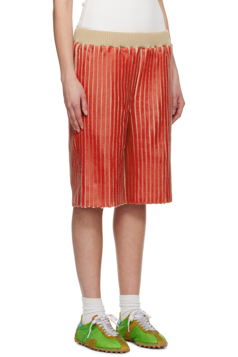 Coated rib-knit merino wool-blend shorts.

· Concealed drawstring at elasticized waistband
· Three-pocket styling

Available exclusively at SSENSE.

Supplier color: Red