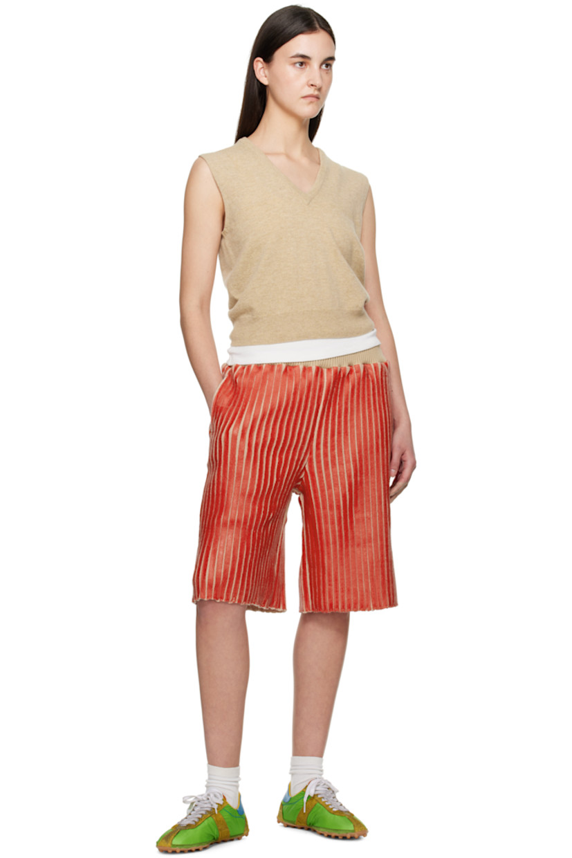 Coated rib-knit merino wool-blend shorts.

· Concealed drawstring at elasticized waistband
· Three-pocket styling

Available exclusively at SSENSE.

Supplier color: Red