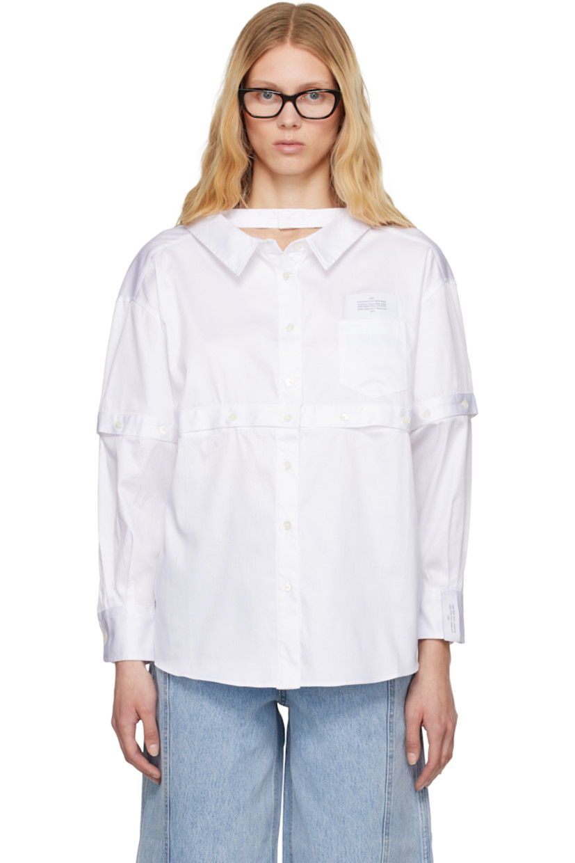 Stretch cotton poplin shirt. 

· Buttoned strap at spread collar
· Button closure
· Logo patch at chest and cuff
· Patch pocket
· Detachable buttoned panel at front, sleeves, and back
· Shirttail hem
· Dropped shoulders
· Pleats at buttoned barrel cuffs

Supplier color: White
