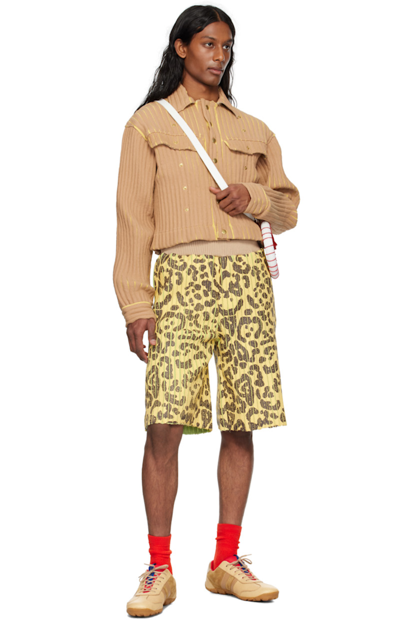 Coated rib-knit merino wool- and acrylic-blend jacket. 

· Spread collar
· Press-stud closure
· Flap pockets at chest
· Studs at front

Supplier color: Camel