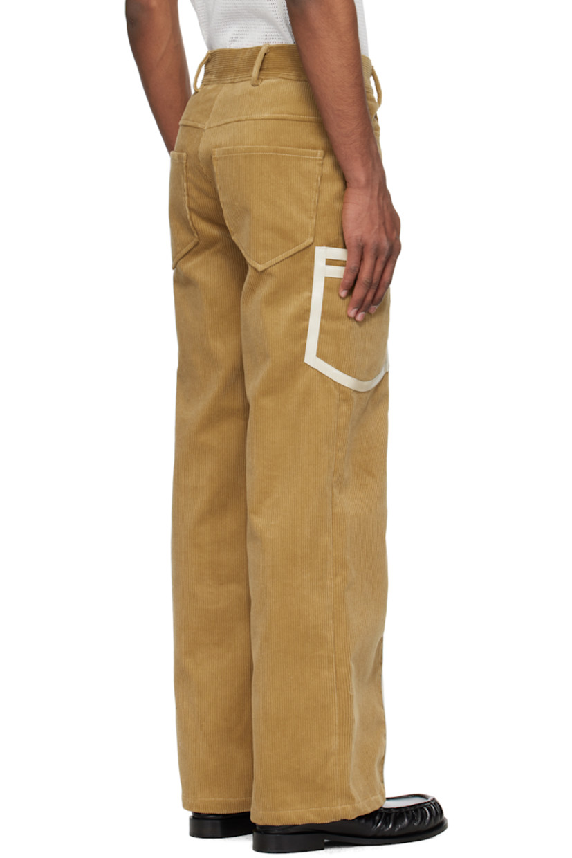 Cotton corduroy cargo pants. Leather trim throughout. 

· Belt loops
· Four-pocket styling
· Zip fly
· Patch pocket at outseams

Supplier color: Beige