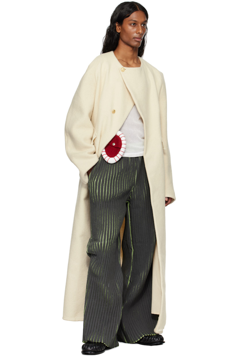 Coated rib-knit merino wool- and acrylic-blend trousers. 

· Elasticized waistband
· Three-pocket styling
· Tuck at knees

Supplier color: Black/Green