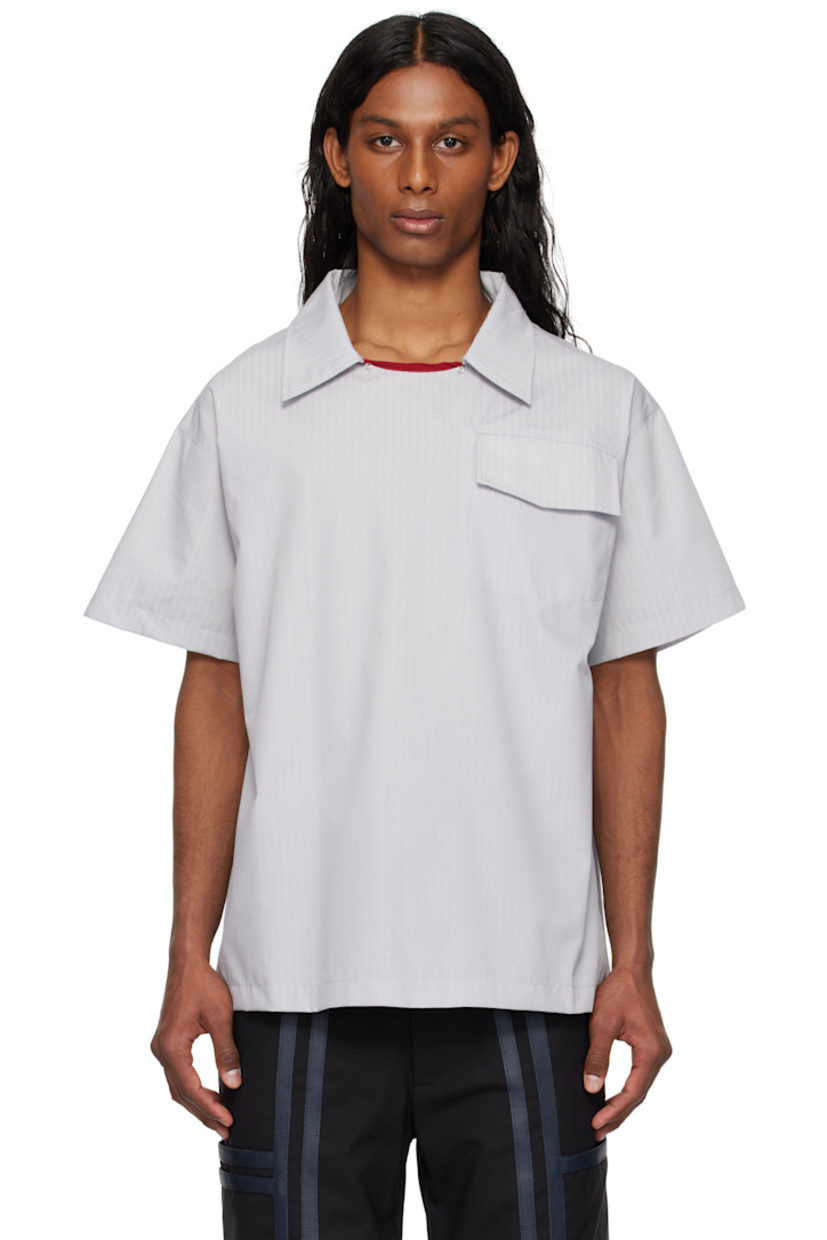 Cotton poplin shirt. Stripes throughout. 

· Press-stud fastening and piping at spread collar
· Flap pocket at chest
· Twin pleats at yoke

Supplier color: Grey