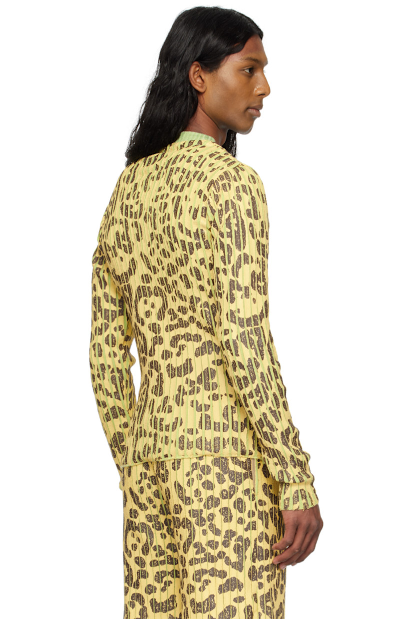 Coated rib-knit merino wool- and acrylic-blend sweater. 

· Leopard pattern printed throughout
· Crewneck

Supplier color: Leopard