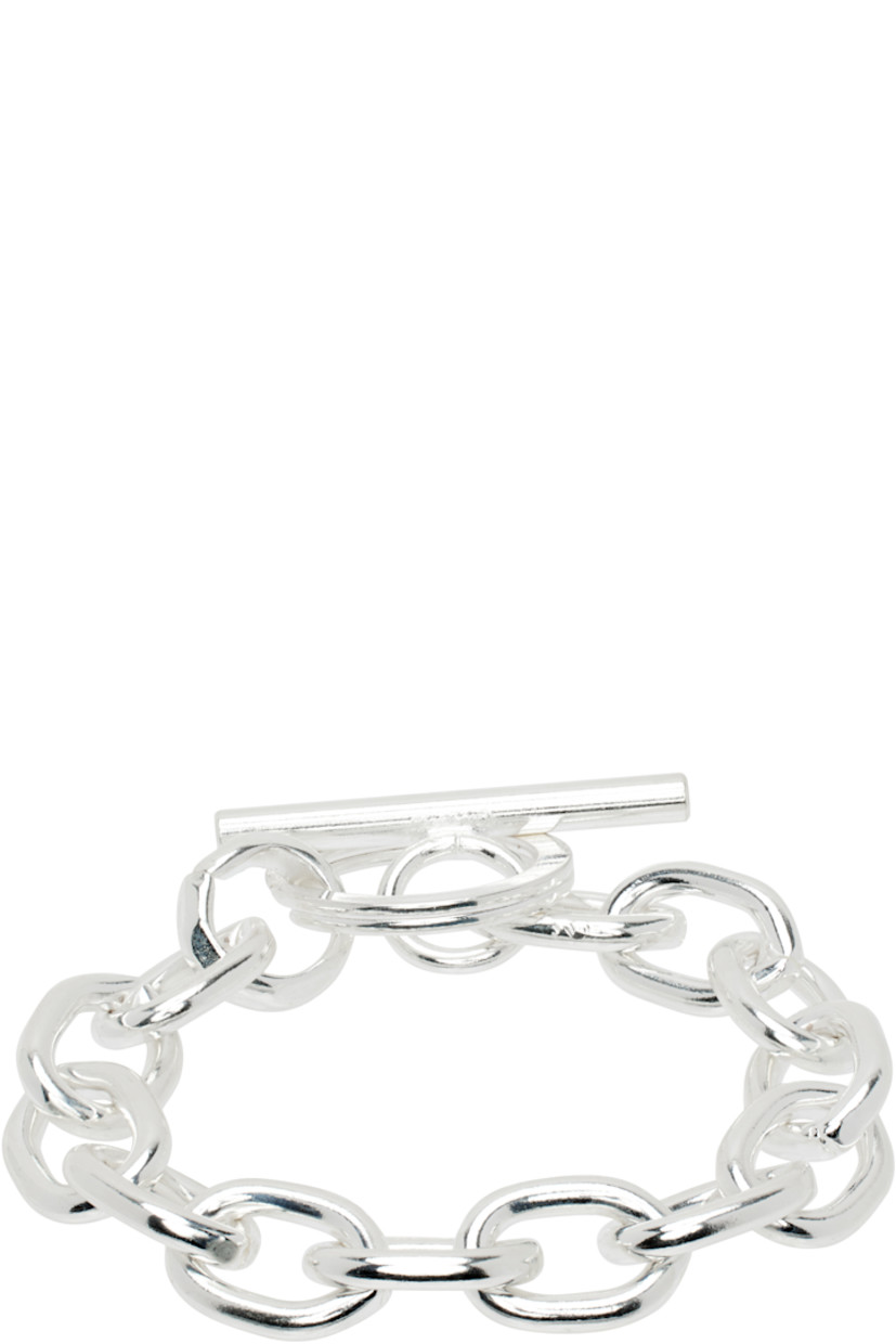 Cable chain bracelet in sterling silver-plated brass. Toggle fastening.

Supplier color: Silver