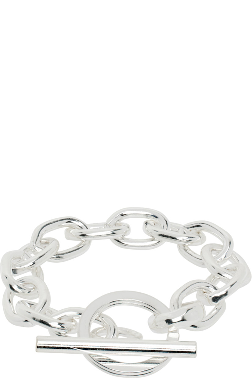 Cable chain bracelet in sterling silver-plated brass. Toggle fastening.

Supplier color: Silver