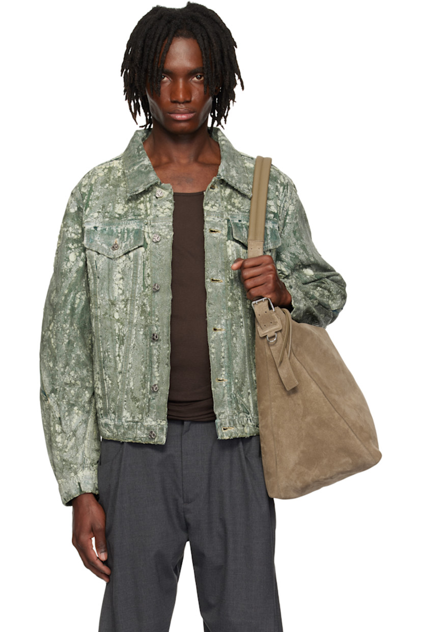 Coated non-stretch denim jacket. 

· Overdyed 
· Spread collar
· Button closure 
· Flap pockets and welt pockets
· Pleat at sleeves
· Buttoned barrel cuffs
· Twin pleats at back
· Button tabs at back hem 
 
Supplier color: Overdyed green