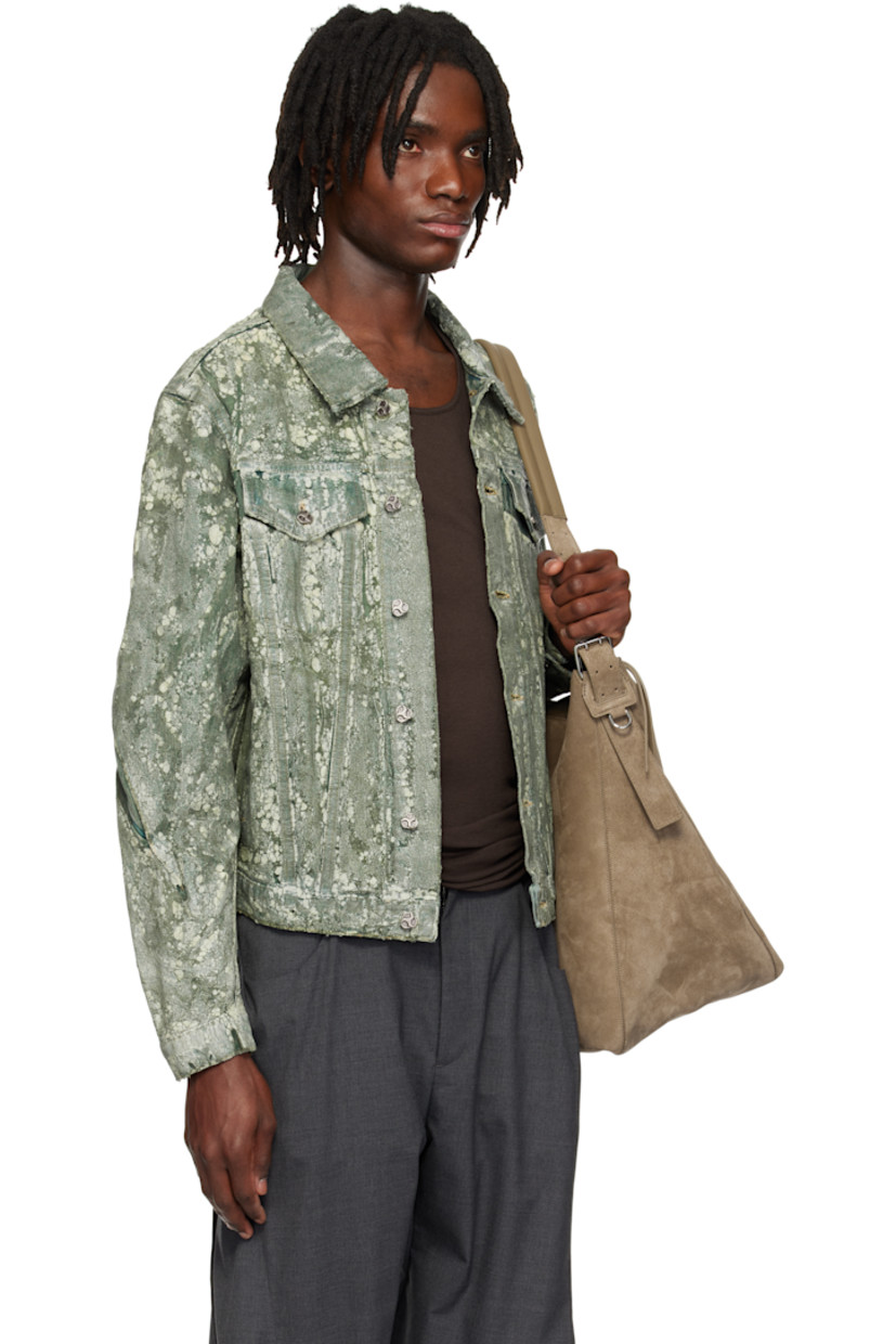 Coated non-stretch denim jacket. 

· Overdyed 
· Spread collar
· Button closure 
· Flap pockets and welt pockets
· Pleat at sleeves
· Buttoned barrel cuffs
· Twin pleats at back
· Button tabs at back hem 
 
Supplier color: Overdyed green