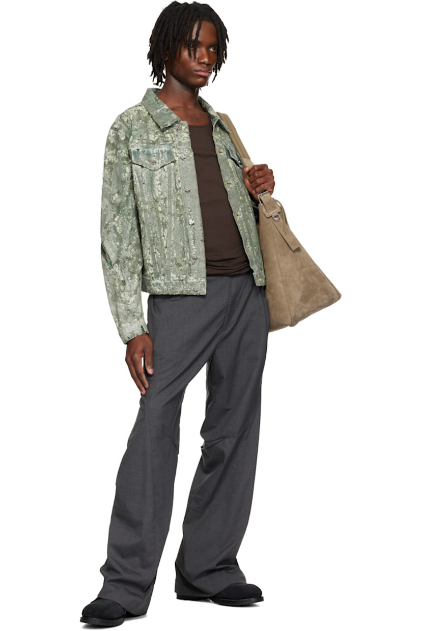 Coated non-stretch denim jacket. 

· Overdyed 
· Spread collar
· Button closure 
· Flap pockets and welt pockets
· Pleat at sleeves
· Buttoned barrel cuffs
· Twin pleats at back
· Button tabs at back hem 
 
Supplier color: Overdyed green