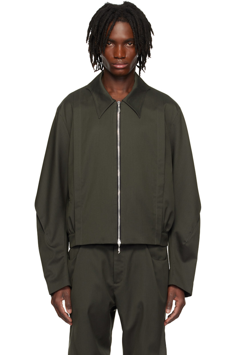 Water-repellent wool- and polyester-blend twill jacket. 

· Modified spread collar
· Two-way zip closure 
· Pintucks at front 
· Welt pockets
· Pleat at sleeves
· Gathering at yoke and back hem 
· Welt pocket at interior 
· Full cupro satin lining 

Supplier color: Tarmac