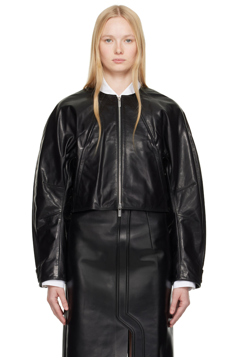 Waxed grained leather jacket. 

· Round neck
· Two-way zip closure
· Zip pockets
· Cropped hem 
· Darts at front and sleeves
· Raglan sleeves
· Adjustable press-stud tab at cuffs
· Logo plaque at back collar
· Full satin lining 

Supplier color: Black