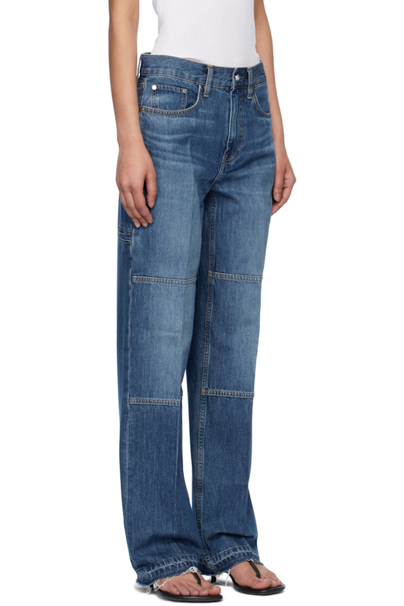 Straight-leg non-stretch denim jeans. Fading and whiskering throughout.

· Mid-rise
· Belt loops
· Five-pocket styling
· Zip fly
· Creased legs
· Raw edge at cuffs
· Welt pocket at outseam
· Leather logo patch at back waistband
· Logo-engraved silver-tone hardware
· Contrast stitching in tan

Supplier color: Tinted indigo