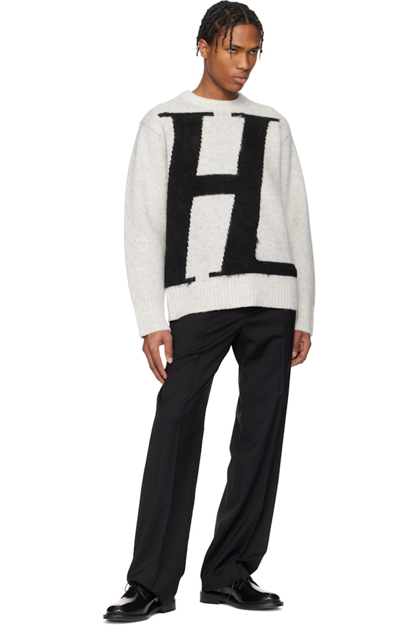 Virgin wool twill trousers. 

· Mid-rise
· Belt loops
· Partially elasticized waistband
· Four-pocket styling
· Zip-fly
· Pinched seams at legs
· Logo plaque at back pocket
· Creases at back
· Partially lined

Supplier color: Black