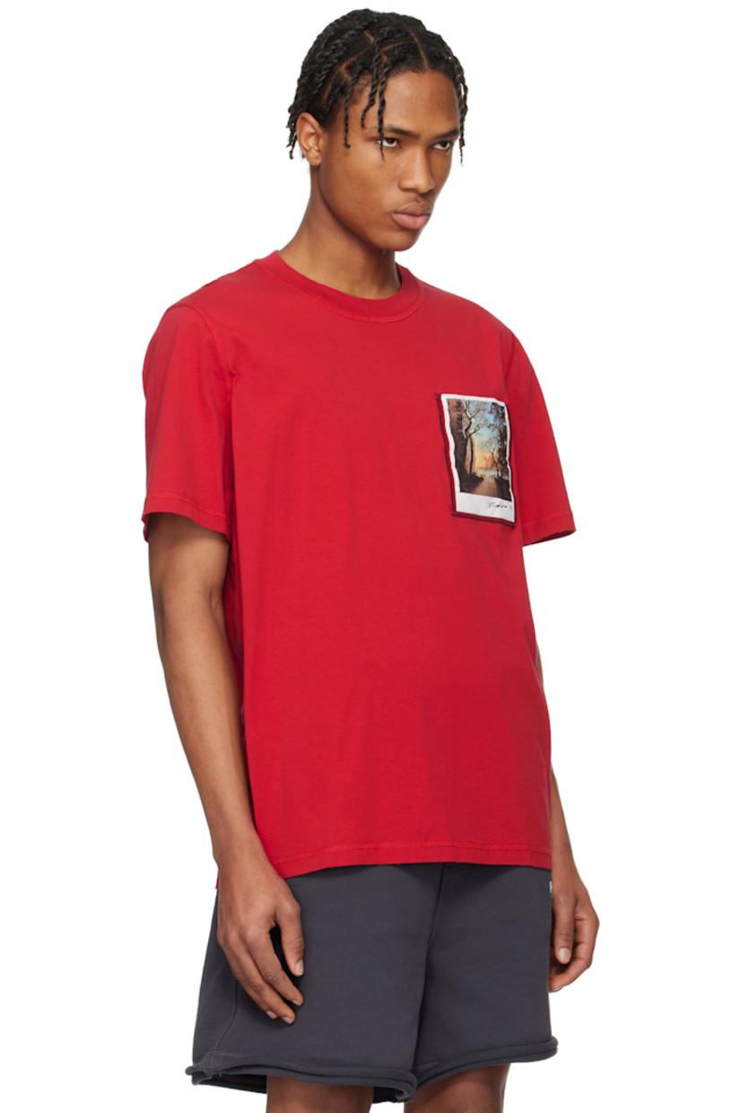 Lightweight cotton jersey T-shirt. Overlock stitching throughout. 

· Enzyme-washed
· Rib-knit crewneck 
· Subtle distressing at collar, hem, and cuffs
· Graphic printed at padded patch pocket
· Logo and text printed at back 

Featuring artwork by Peter Do.

Supplier color: Savy red