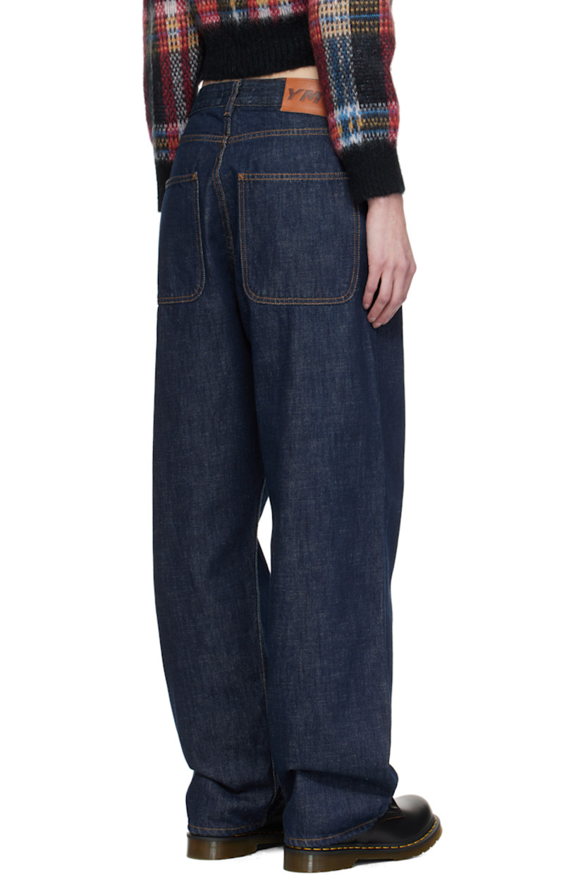 Rinse-washed non-stretch organic cotton selvedge denim jeans.

· Baggy-fit
· Belt loops
· Five-pocket styling
· Zip-fly
· Leather logo patch at back waistband
· Contrast stitching in tan 

Supplier color: Indigo