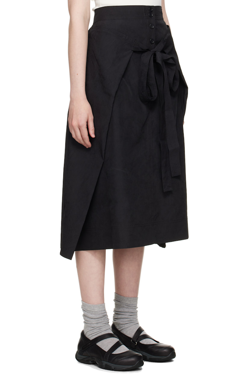 Crinkled polyester taffeta midi skirt. Integrated self-tie panel for alternate styling.

· Wrap construction 
· Four-pocket styling
· Pleats at front 
· Button closure at back
· Corozo hardware

Supplier color: Black
