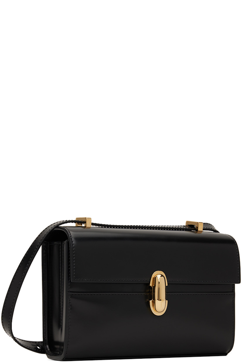 Polished calfskin shoulder bag in black.

· Adjustable sliding crossbody strap 
· Turn-lock flap
· Patch pocket at two-compartment interior
· Buffed calfskin lining
· H5.25" x W7.5" x D2.75"

Supplier color: Black