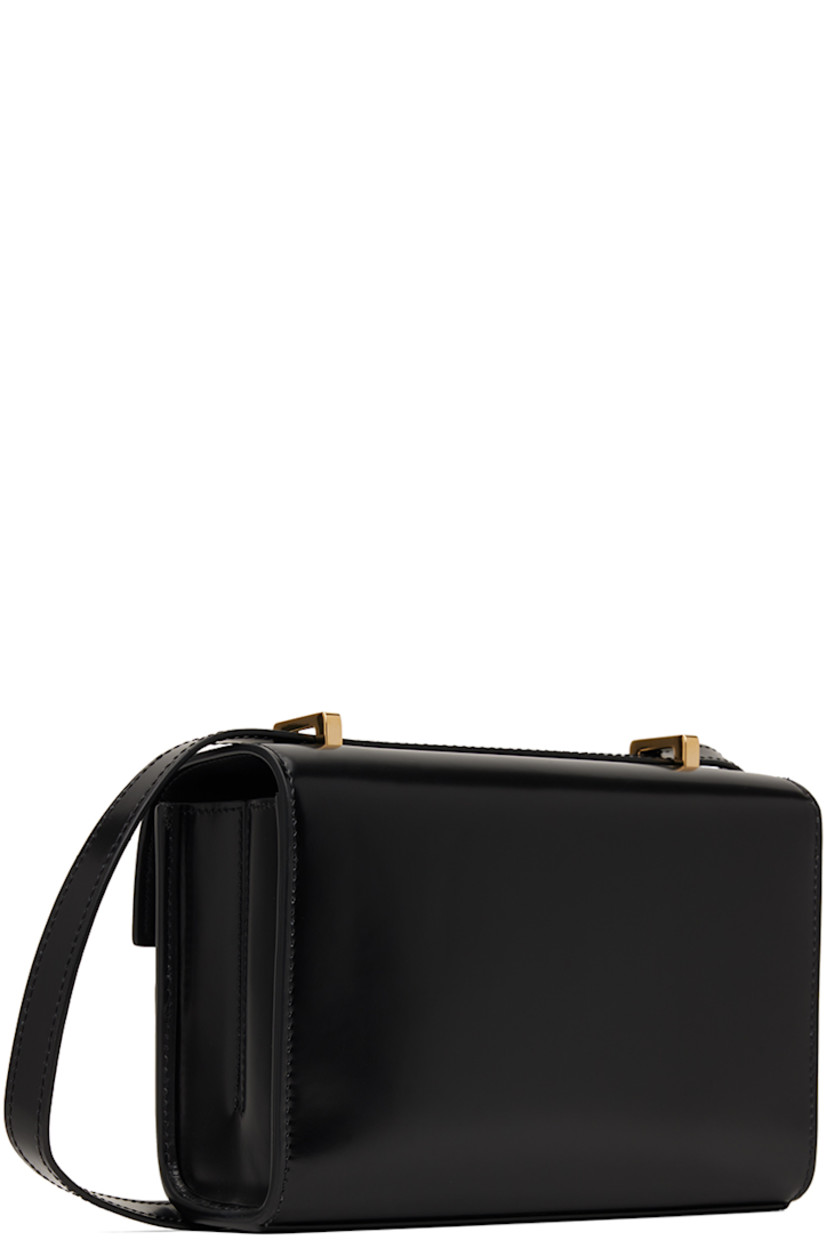 Polished calfskin shoulder bag in black.

· Adjustable sliding crossbody strap 
· Turn-lock flap
· Patch pocket at two-compartment interior
· Buffed calfskin lining
· H5.25" x W7.5" x D2.75"

Supplier color: Black