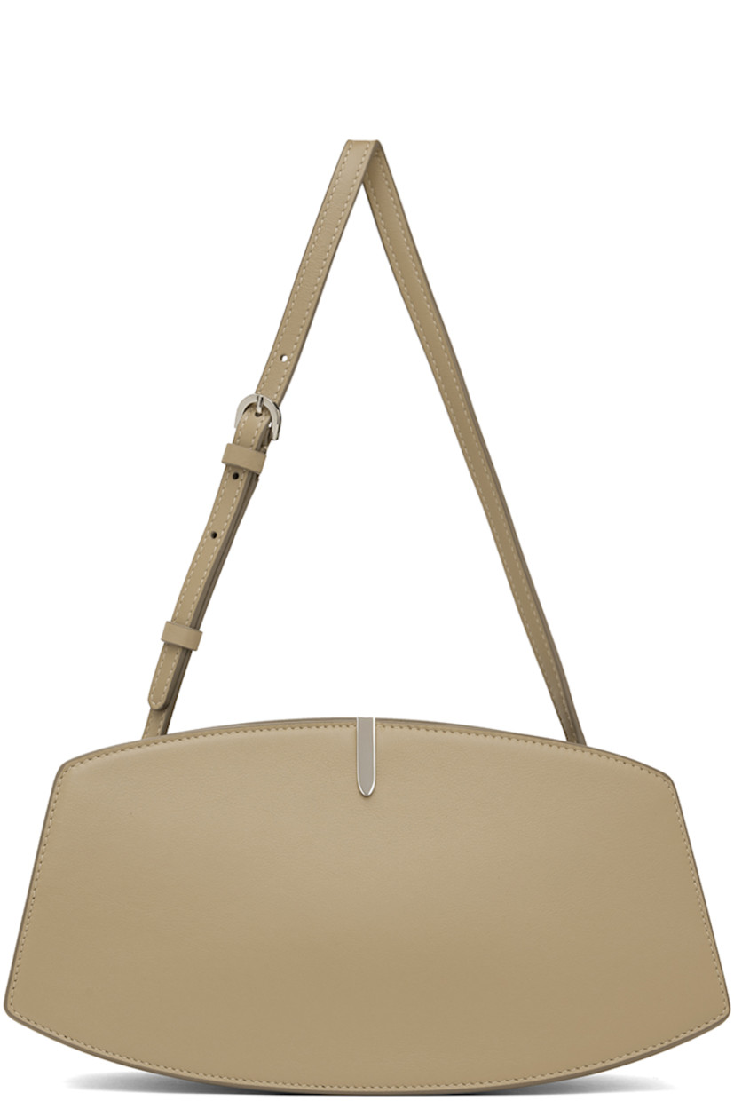 Buffed calfskin shoulder bag in beige.

· Adjustable shoulder strap 
· Silver-tone hardware at face 
· Accordion panel at sides
· Logo stamp at back face 
· Magnetic tab closure 
· Card slot at two-compartment interior
· Buffed calfskin lining 
· H5.75" x W10.75 x D4"

Supplier color: Clay