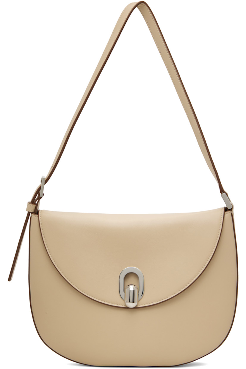 Buffed calfskin shoulder bag in beige.

· Burnished edges throughout
· Adjustable shoulder strap
· Tab-slot flap
· Card slot at interior
· Calfskin suede interior
· H7.5" x W10" x D0.75"

Supplier color: Bone