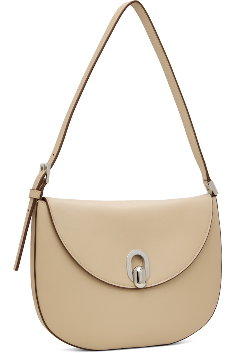 Buffed calfskin shoulder bag in beige.

· Burnished edges throughout
· Adjustable shoulder strap
· Tab-slot flap
· Card slot at interior
· Calfskin suede interior
· H7.5" x W10" x D0.75"

Supplier color: Bone