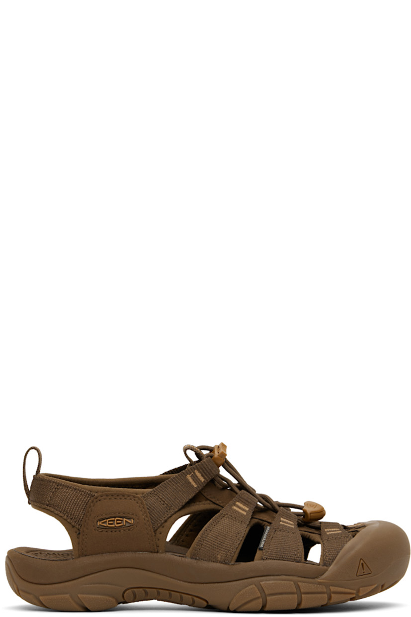 Webbing and faux-suede sandals in brown.

· Anti-odor
· Cutouts throughout
· KEEN.PROTECT rubber cap toe
· Bungee-style lace-up closure
· Pull-loop at heel collar
· Rubberized logo patch at outer side
· Shock-absorbing molded foam insole
· Jersey lining
· Foam rubber midsole
· Treaded rubber sole

Supplier color: Monochrome/Dark earth