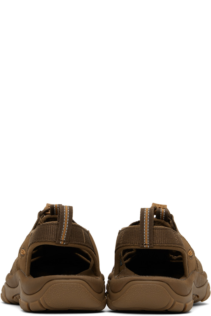 Webbing and faux-suede sandals in brown.

· Anti-odor
· Cutouts throughout
· KEEN.PROTECT rubber cap toe
· Bungee-style lace-up closure
· Pull-loop at heel collar
· Rubberized logo patch at outer side
· Shock-absorbing molded foam insole
· Jersey lining
· Foam rubber midsole
· Treaded rubber sole

Supplier color: Monochrome/Dark earth