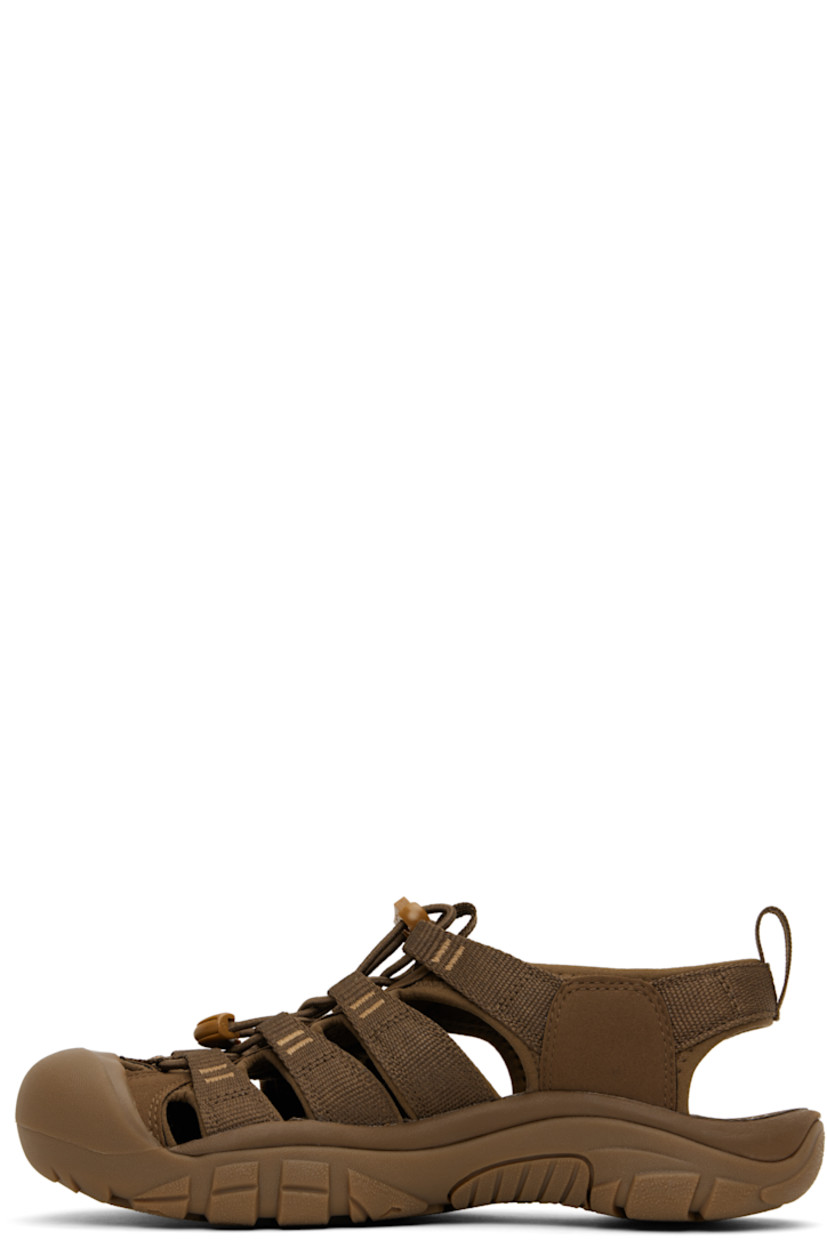 Webbing and faux-suede sandals in brown.

· Anti-odor
· Cutouts throughout
· KEEN.PROTECT rubber cap toe
· Bungee-style lace-up closure
· Pull-loop at heel collar
· Rubberized logo patch at outer side
· Shock-absorbing molded foam insole
· Jersey lining
· Foam rubber midsole
· Treaded rubber sole

Supplier color: Monochrome/Dark earth