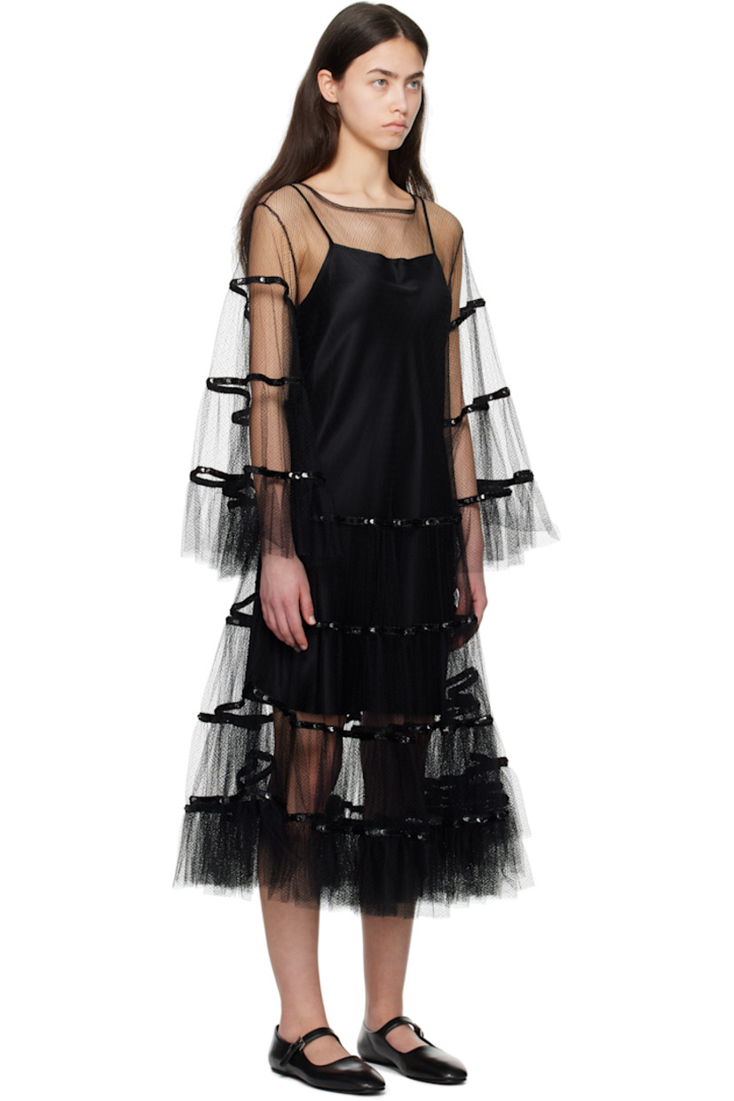 Sheer nylon tulle midi dress. 

· Boatneck
· Sequinned detailing at skirt and sleeves
· Ruffled trim at hem and cuffs
· Button keyhole at back collar
· Removable silk satin slip-style underlay

This item is part of a limited run of 4.

Supplier color: Black