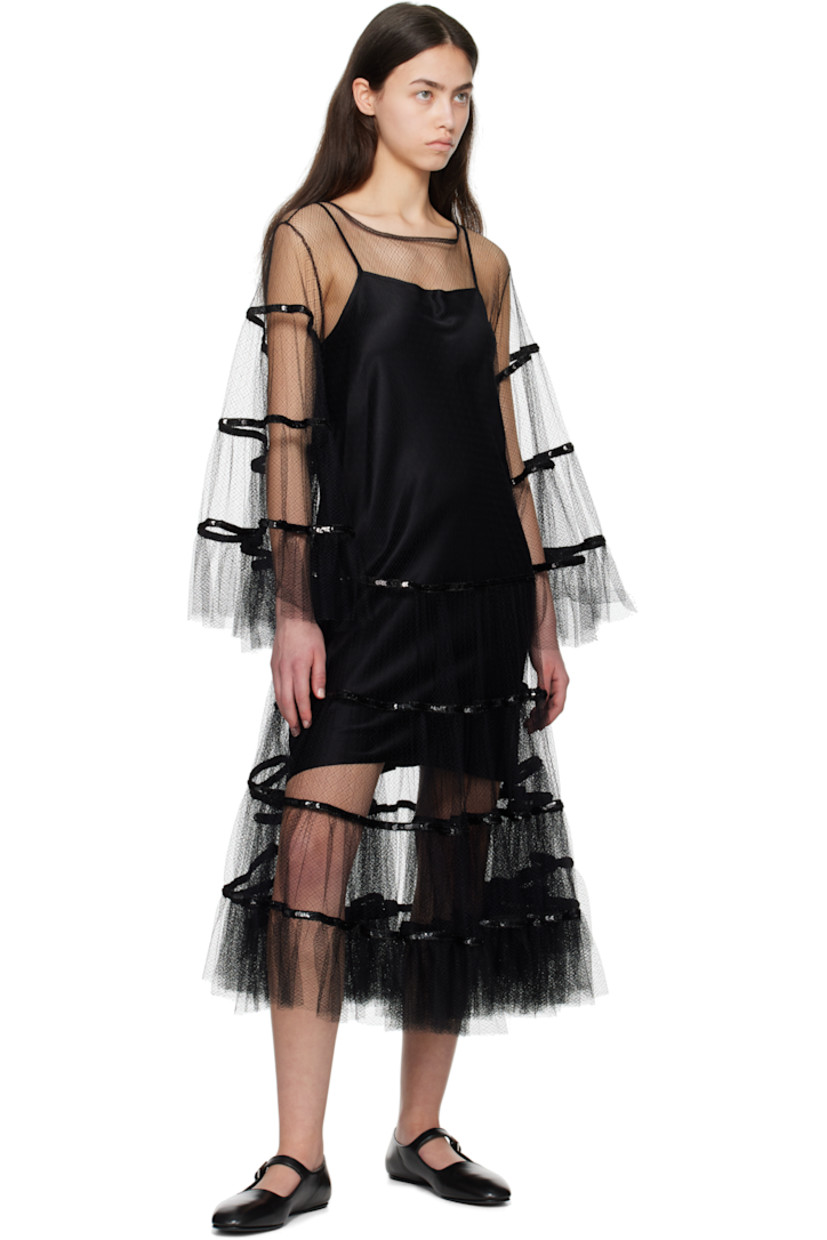 Sheer nylon tulle midi dress. 

· Boatneck
· Sequinned detailing at skirt and sleeves
· Ruffled trim at hem and cuffs
· Button keyhole at back collar
· Removable silk satin slip-style underlay

This item is part of a limited run of 4.

Supplier color: Black