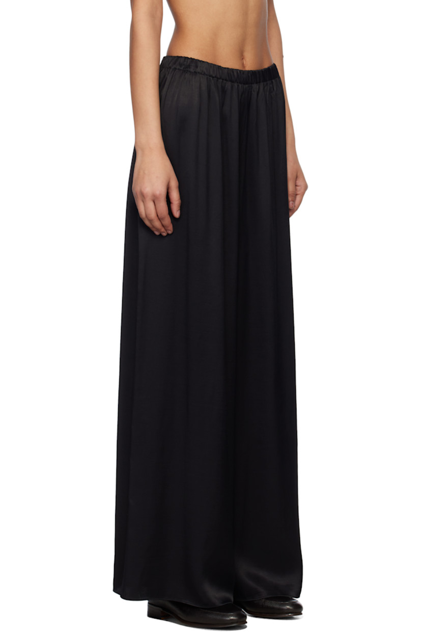 Loose-fit viscose satin trousers. Elasticized waistband.

This item is part of a limited run of 90.

Supplier color: Black