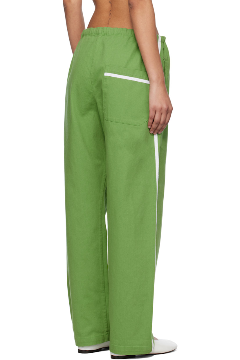 Cotton twill trousers.

· Drawstring at waistband
· Three-pocket styling
· Exposed button fly
· Striped trim at outseams

This item is part of a limited run of 50.

Supplier color: Green/White