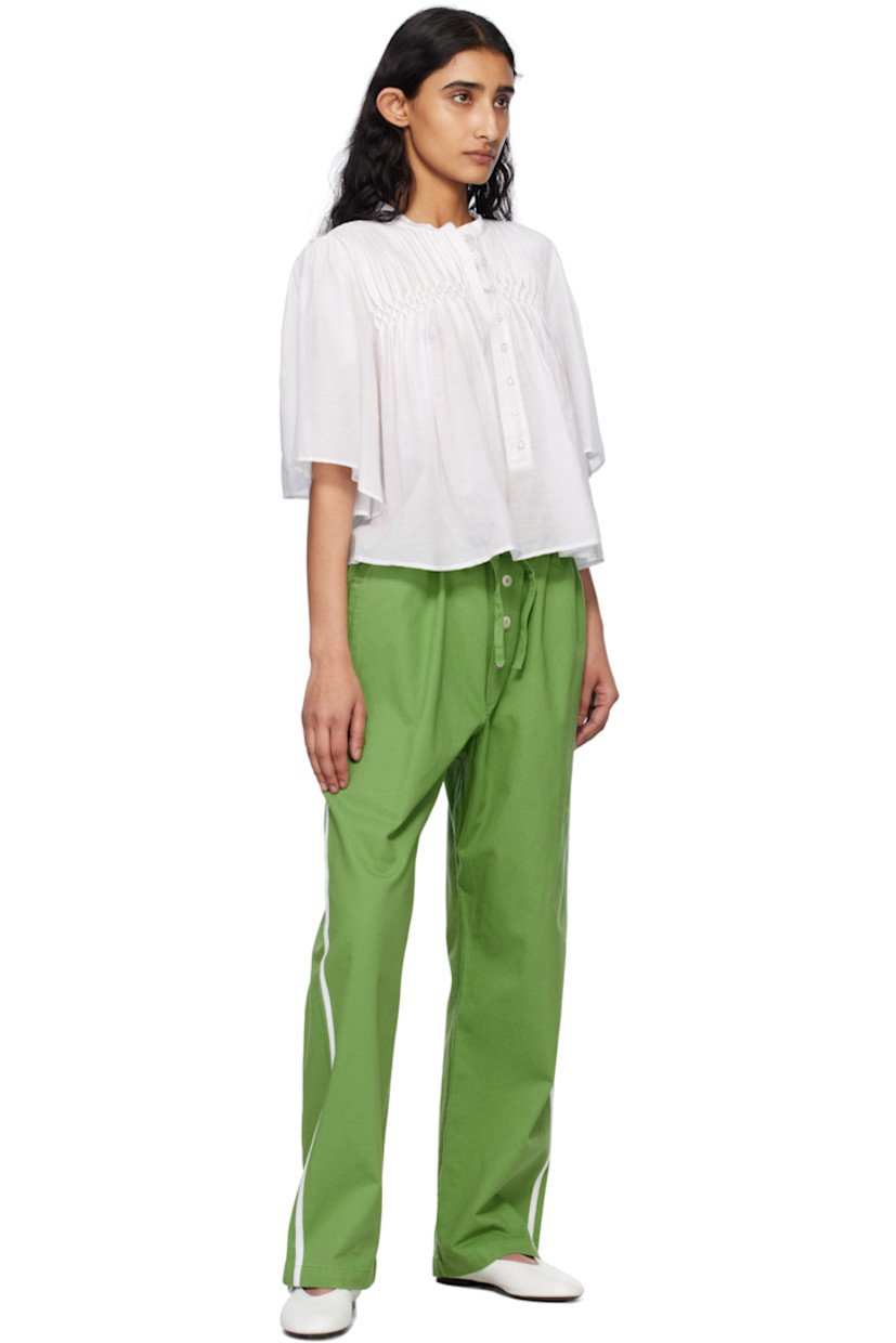 Cotton twill trousers.

· Drawstring at waistband
· Three-pocket styling
· Exposed button fly
· Striped trim at outseams

This item is part of a limited run of 50.

Supplier color: Green/White