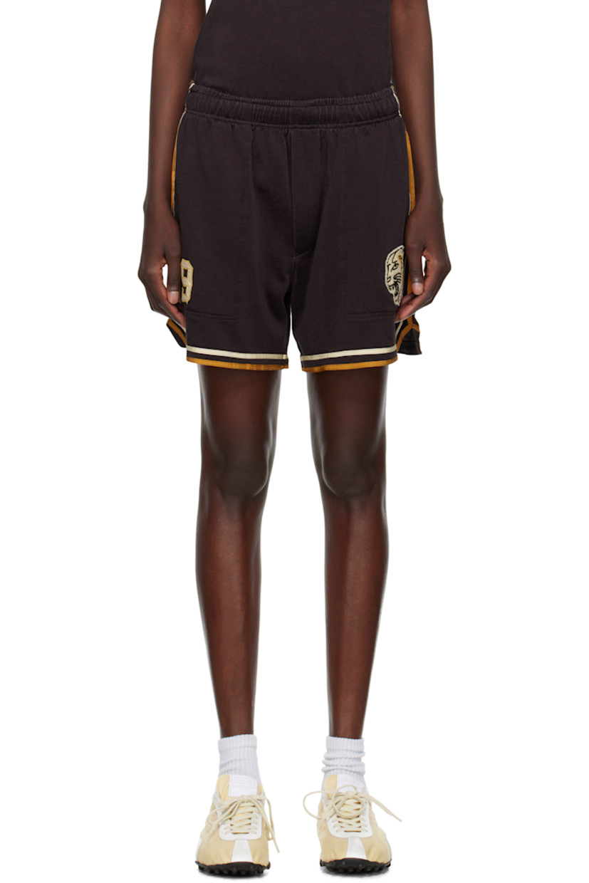 Rayon- and cotton-blend jersey shorts. 

· Concealed drawstring at elasticized waistband
· Three-pocket styling
· Graphic and text appliqués at front 
· Stripes at outseams, back, and cuffs 

This item is part of a limited run of 80.

Supplier color: Brown/Black