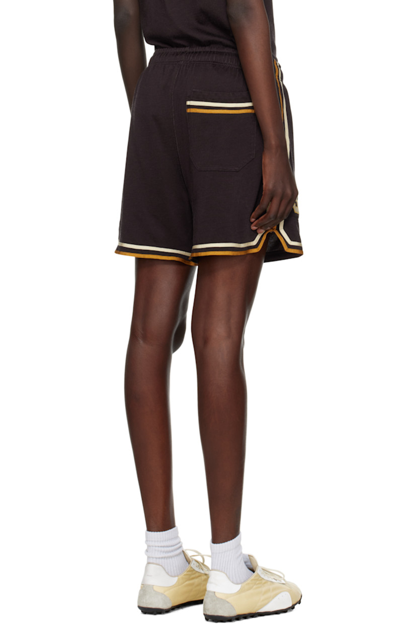 Rayon- and cotton-blend jersey shorts. 

· Concealed drawstring at elasticized waistband
· Three-pocket styling
· Graphic and text appliqués at front 
· Stripes at outseams, back, and cuffs 

This item is part of a limited run of 80.

Supplier color: Brown/Black