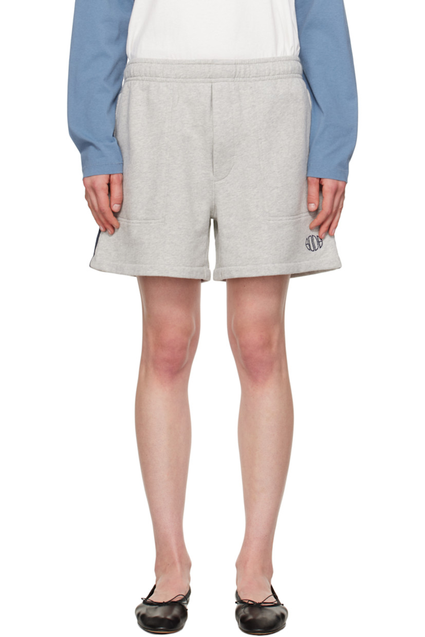 French terry shorts.

· Concealed drawstring at elasticized waistband
· Three-pocket styling
· Logo embroidered at leg
· Stripe appliqué at outseams

Supplier color: Heathered grey