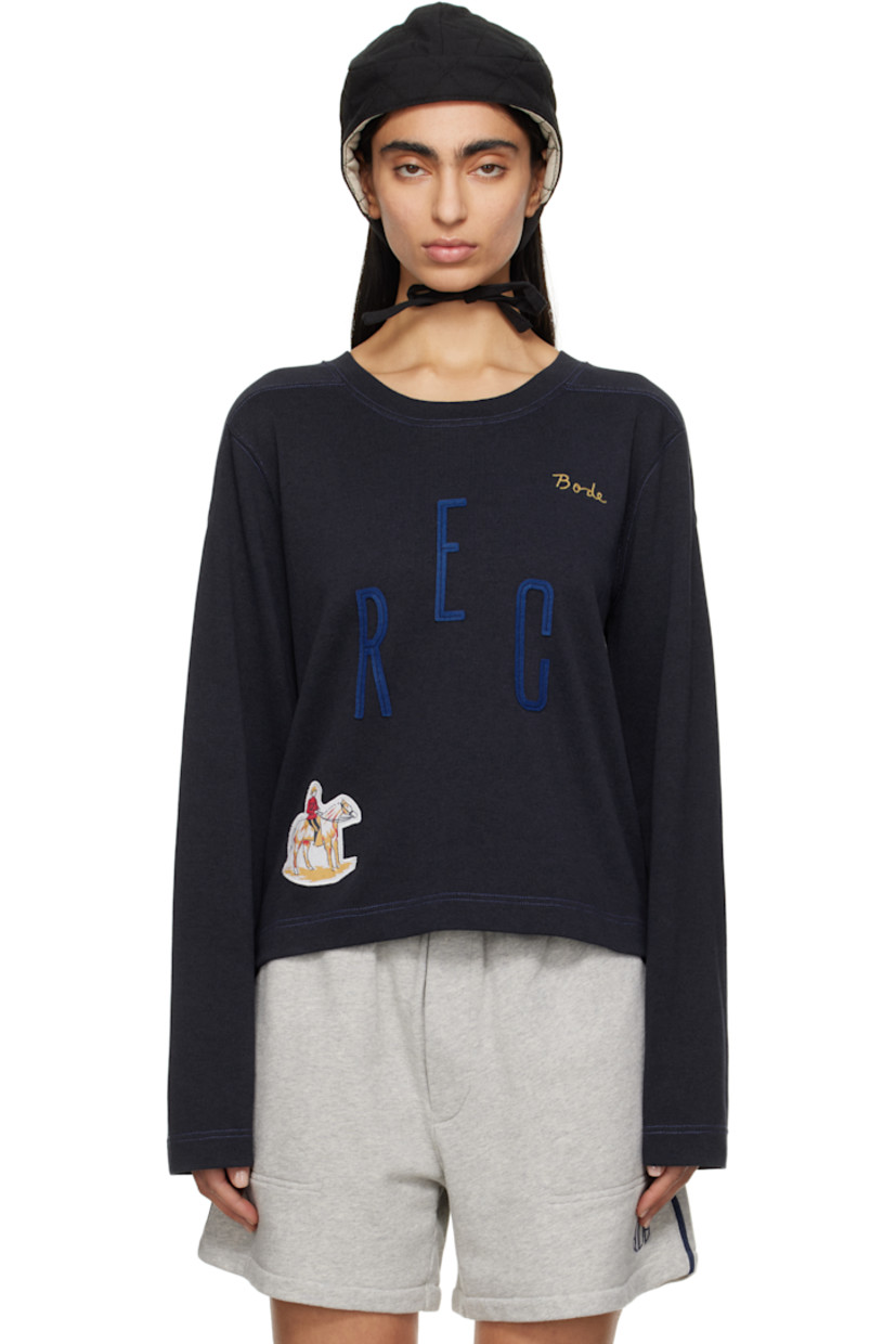 Heavyweight cotton- and lyocell-blend jersey sweatshirt.

· Rib-knit crewneck
· Logo embroidered at chest
· Felted text appliqués at front
· Graphic patch at hem
· Modified saddle shoulders
· Contrast stitching in blue

This item is part of a limited run of 90.

Supplier color: Navy