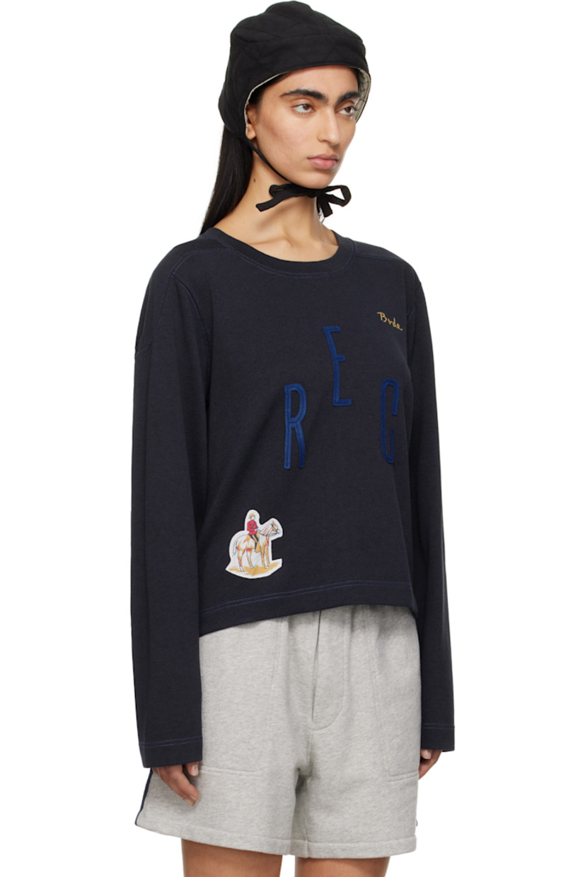 Heavyweight cotton- and lyocell-blend jersey sweatshirt.

· Rib-knit crewneck
· Logo embroidered at chest
· Felted text appliqués at front
· Graphic patch at hem
· Modified saddle shoulders
· Contrast stitching in blue

This item is part of a limited run of 90.

Supplier color: Navy